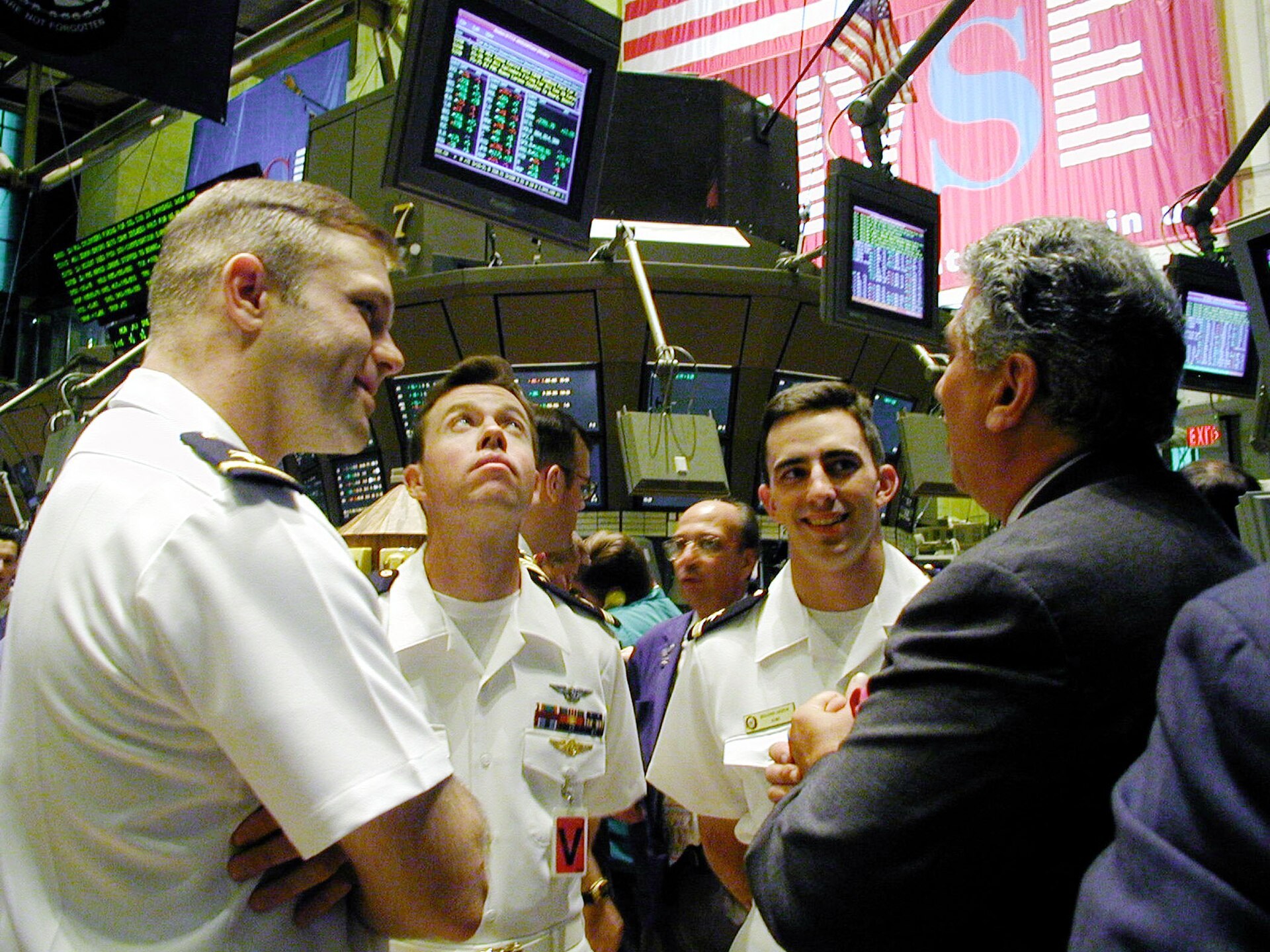 Traders and visitors on the floor of the New York Stock Exchange