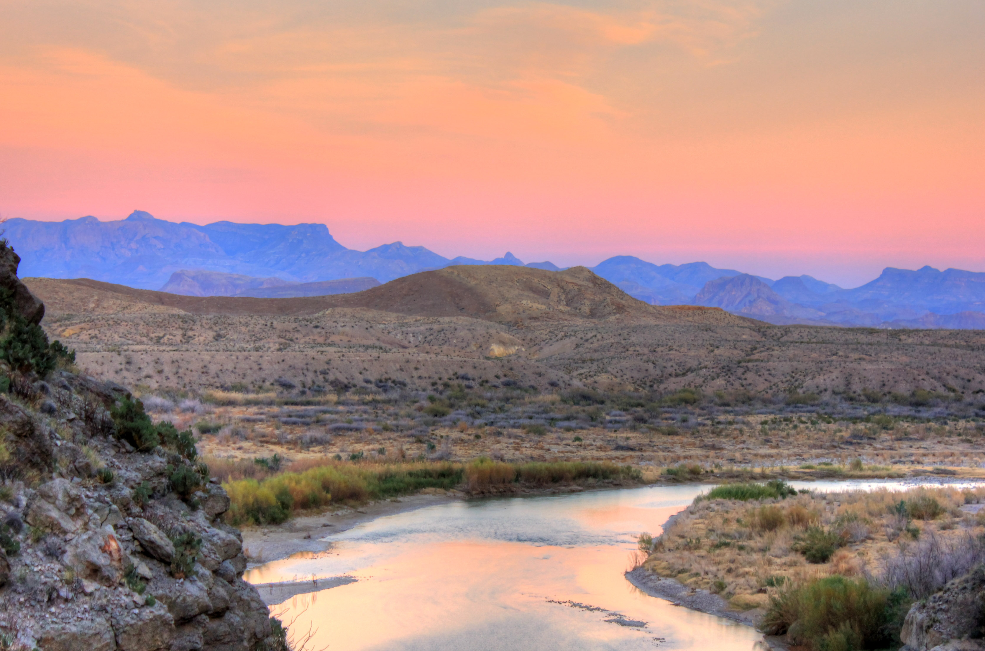 Rio Grande flowing out of Santa Elena Canyon at sunset in Big Bend National Park