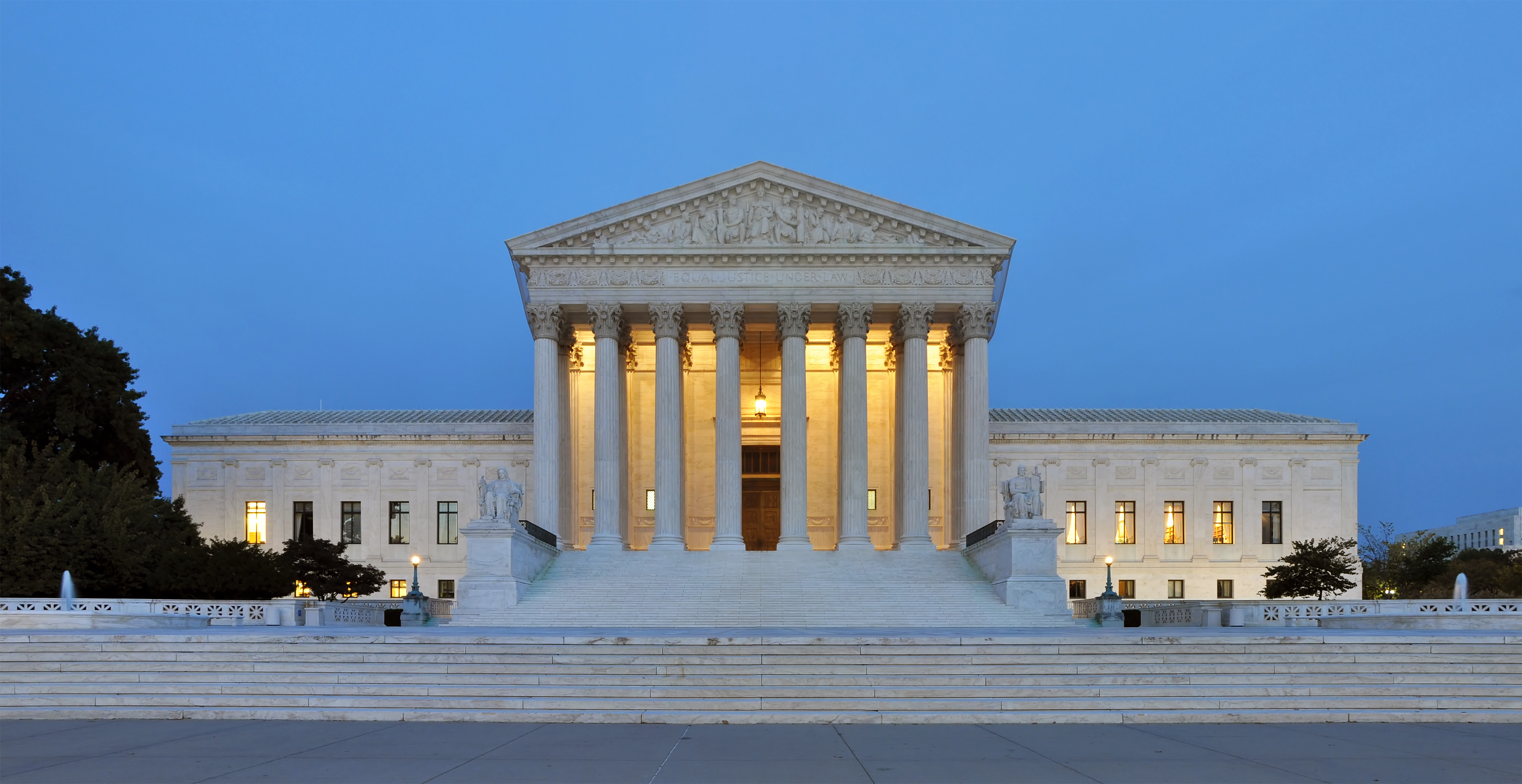 United States Supreme Court Building west facade at dusk in Washington, D.C.