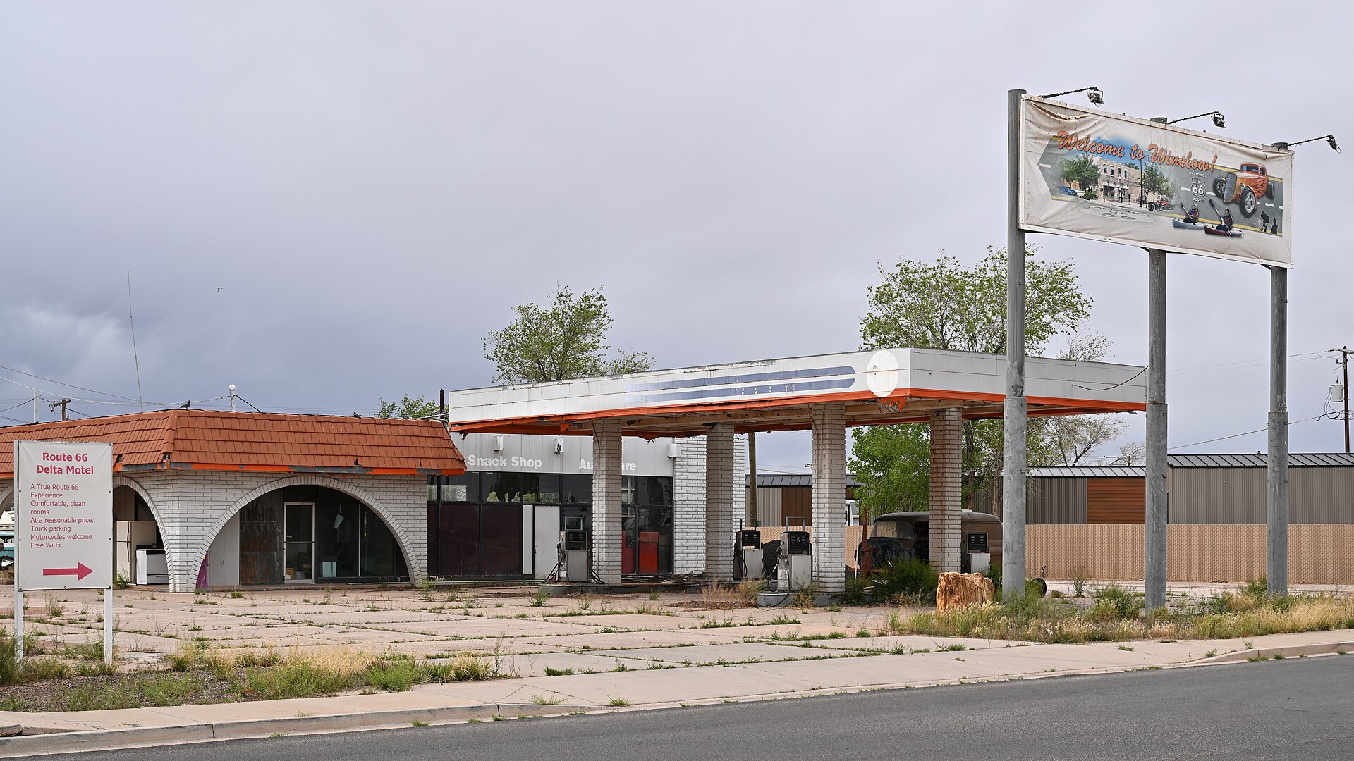 Gas pump nozzles and price display at a fuel station